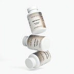 Three bottles of Vital Glow NAD+ Booster on a white background