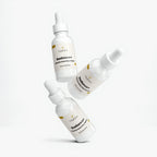 Three bottles of VitalCare Radiance+ Vitamin Glow Day Cream on a white background