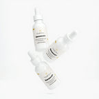 Three bottles of VitalCare Renewal+ serum on a white background